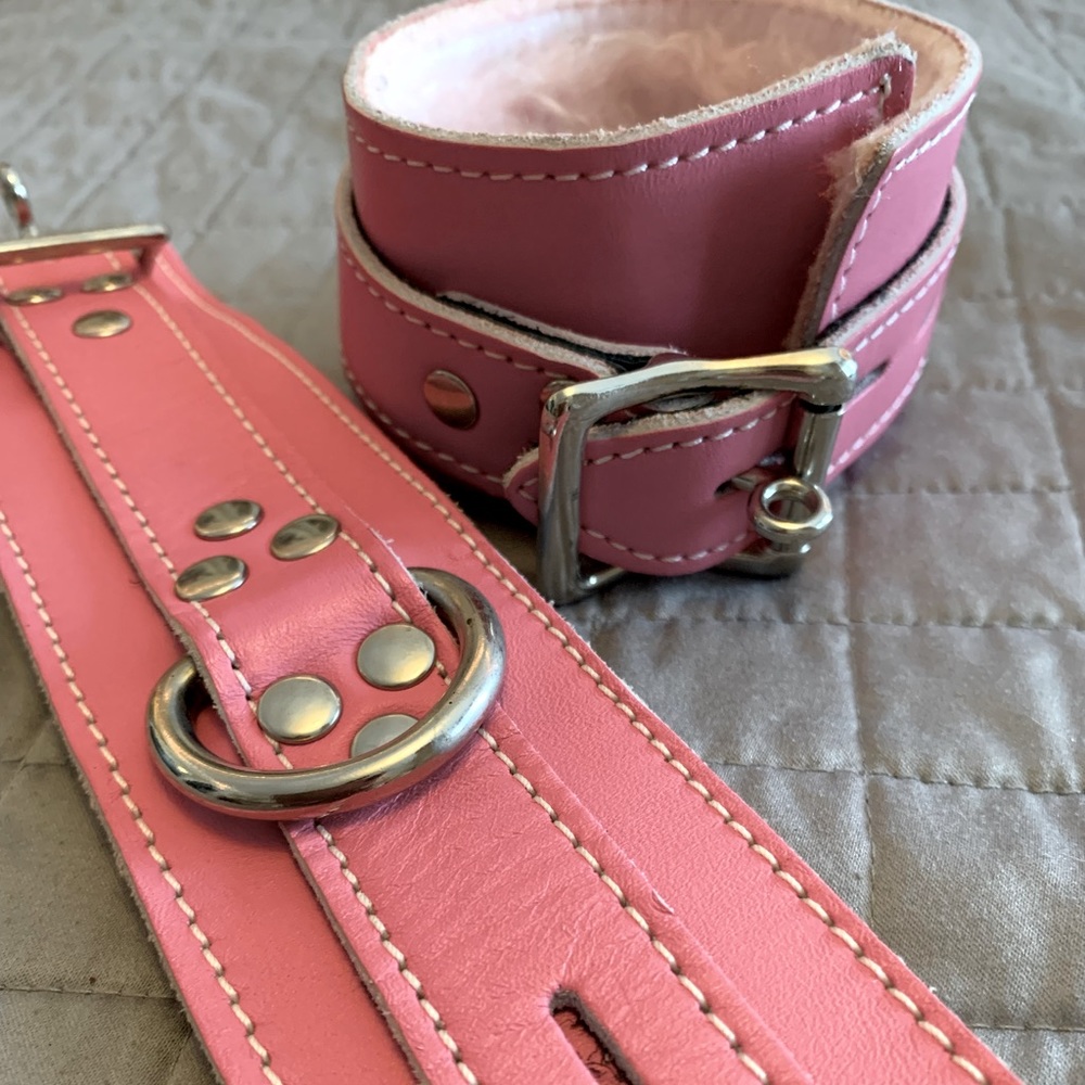 Pink leather furry handcuffs.